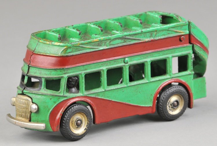 DOUBLE DECKER BUS: Arcade, cast iron, painted in green with painted red side band, upper deck bench seating, rubber tires. 8" l.