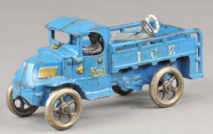 MACK ICE TRUCK: Arcade, an early enclosed Mack cab with railed body and rear platform, reads "ICE" on sides, Arcade decal, nickeled spoke wheels and driver, includes tongs and ice cube. 8 1/4" l.