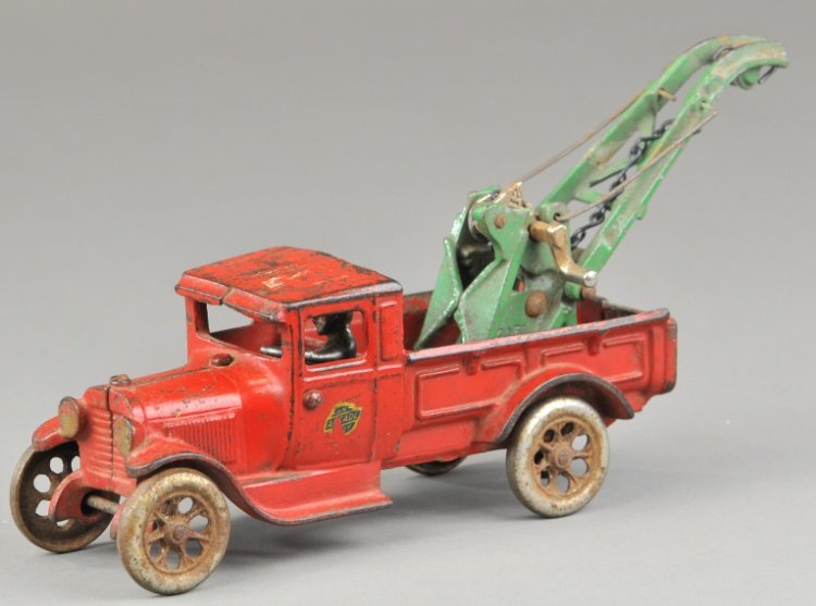 ARCADE MODEL 'A' WEAVER WRECKER: Cast iron, painted in red with green "WEAVER" stamped boom on service bed, nickel spoke wheels, Arcade decal on door. 11" l.