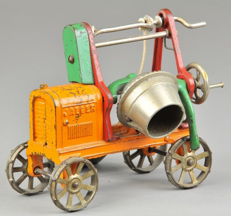 KENTON JAEGER CONCRETE MIXER: Cast iron mixer painted in orange body, red and green frame, aluminum drum and scoop, cast iron spoke wheels. 6 1/2" l.