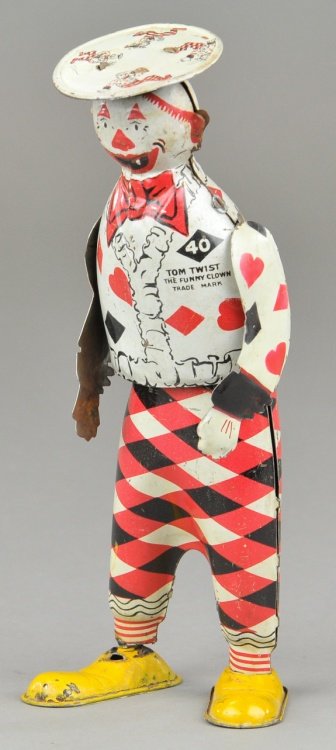 TOM TWIST STAND UP FIGURE: Ferdinand Strauss, lithographed tin, marked Tom Twist the "Funny Clown," wind up action. 8 1/2" h.