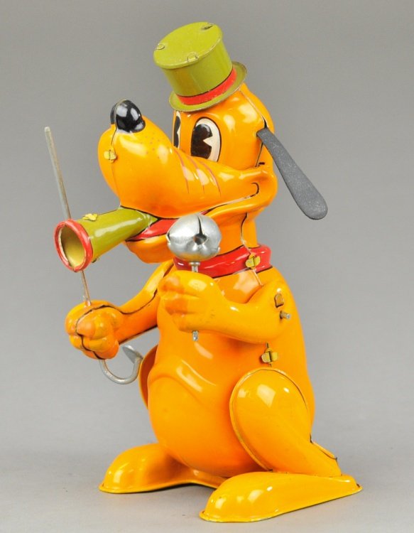 PLUTO DRUM MAJOR: Linemar, Japan, Walt Disney Prod., lithographed tin, depicts Pluto wearing parade hat, holding bell in hand and horn in mouth, clockwork mechanism. 6" h.
