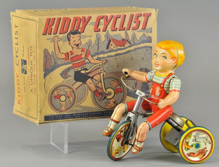 UNIQUE ART KIDDY CYCLIST IN ORIGINAL BOX: Litho tin wind up with ringing bell, working, includes original box. 7 1/2" x 9".