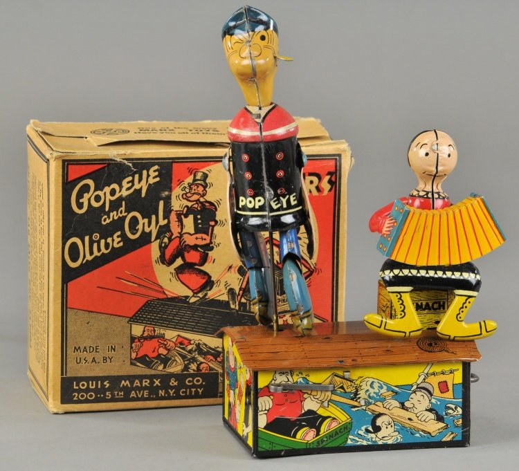 POPEYE & OLIVE OYL JIGGERS: Louis Marx, boxed example, lithographed tin, colorful graphics, classic toy depicts dancing Popeye figure and Olive Oyl playing accordion. 9 1/2" h.