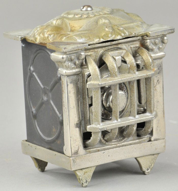 HEXAGON DOOR SAFE STILL BANK W/GRILLE: Klotz Mfg. Co., cast iron with tin sides, nickel plated finish, unique grille front design, combination dial. 4 1/2" h.