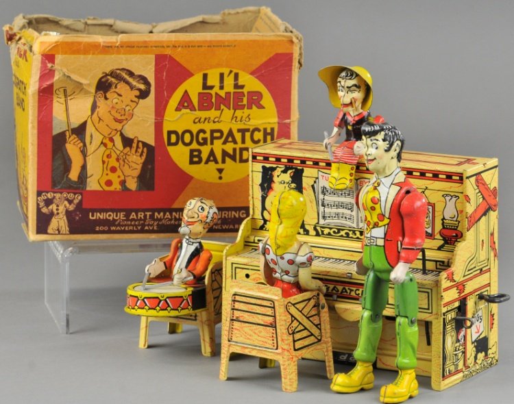 LIL ABNER DOG PATCH BAND W/BOX: Unique Art, lithographed tin, a classic mechanical comic band toy featuring four members of the Dogpatch Band, colorful and amusing. 9" w.