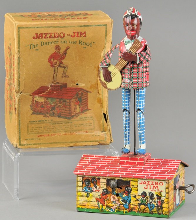 BOXED JAZZBO JIM: Unique Art, boxed example of dancer on roof top, done in lithographed tin, depicts figure with banjo in hand, standing on colorful roof top base, clockwork driven. 10" h.