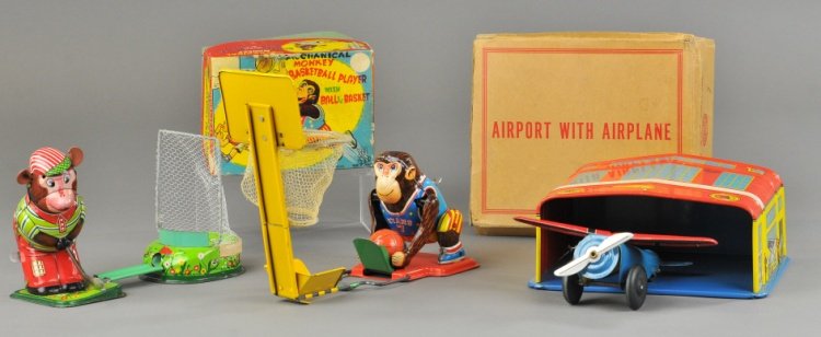 LOT OF TIN TOYS: Mixed grouping includes Marx boxed Airport with Airplane toy, Monkey Golfer wind up toy with box and Monkey Basketball Player wind up toy with box. 7" to 7 1/2" w.