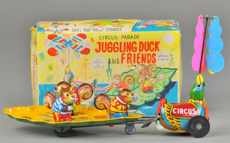 JUGGLING DUCK & FRIENDS W/BOX: TPS, Japan, lithographed tin clockwork with colorful plastic whirling blades, a more elusive variation. 5 3/4" h.