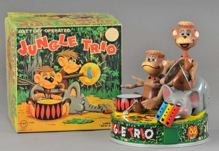 BATTERY-OP JUNGLE TRIO: Linemar, lithographed tin, rubber heads and limbs, monkeys beat drum and bang cymbals, elephant head turns to play flute, squeaker sounds. 6 1/2" dia., 7" h.