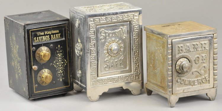 LOT OF THREE SAFE VAULT STILL BANKS: Includes scarce Bank of Commerce example made by Mudd Mfg. Co., done in nickel plated cast iron, a re-nickeled Security Safe Bank and black tin Keyless Savings bank with double combination dial. 4 7/8