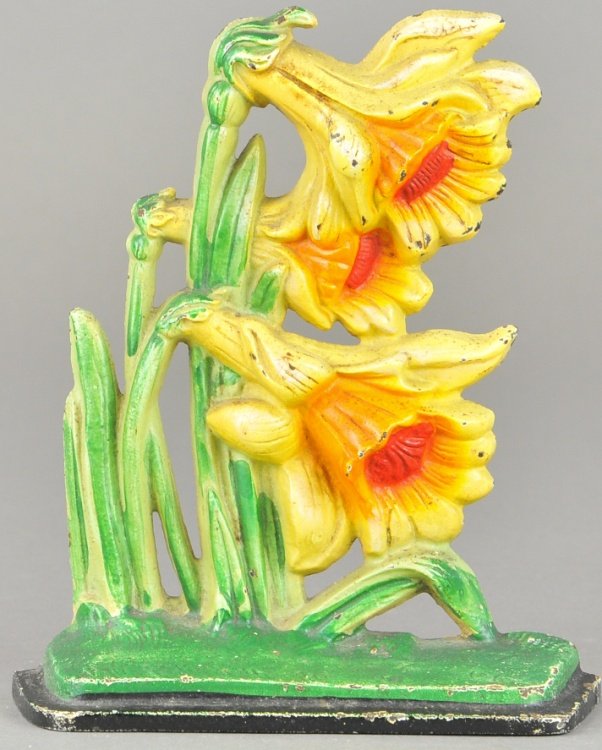 JONQUILS DOORSTOP: Hubley, "453," depicts bright yellow long flowers blowing in the wind, fantastic colors. 7" x 6".