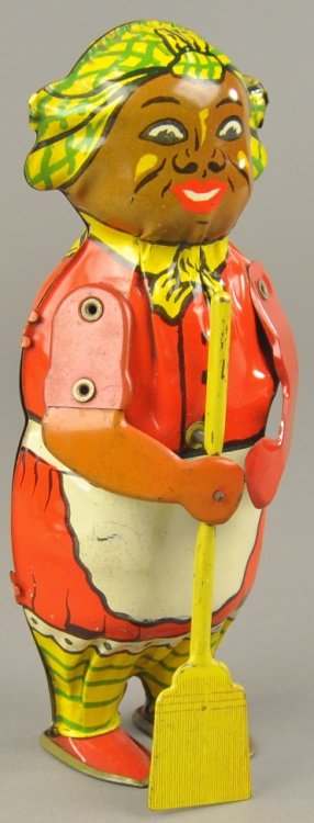 MAMMY WALKER: Lindstrom, lithographed tin, figure depicts black woman in red dress with white apron, clockwork mechanism, activates motion. 7 3/4" h.