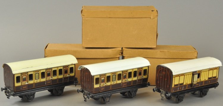 BOXED MARKLIN 1 GAUGE FIRST CLASS L&NWR CARS: Germany, made and stamped for Gamage of England, lot includes three cars done in lithographed tin bodies and painted roofs, includes two #2871 cars and one #2872 Guard Van, each in box, two have stamp