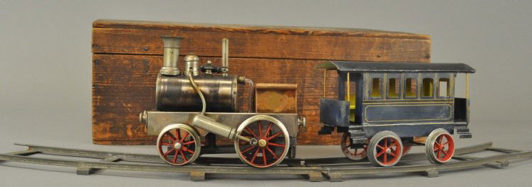 SCHOENNER GAUGE 'IV' STEAM LOCOMOTIVE & TENDER: Germany, boxed set, early example , mostly nickeled overall, red painted spoke wheels, together with tin coach with steps and bench seating. 7" l.