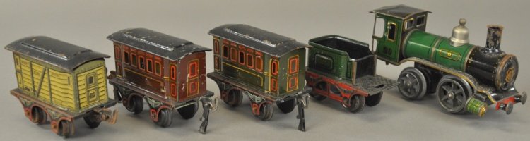 MARKLIN 'O' GAUGE TRAIN SET: Germany, lithographed tin train set features 0-4-0 clockwork locomotive with four wheel tender, together with two #61 passenger cars and #63 stock car, a desirable example. Loco 6 1/2" l.