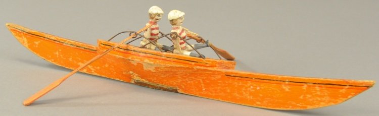 EARLY WOODEN TWO MAN SCULL: French made toy, well detailed wooden hull, contains two hand painted composition figures, wire oars holders on sides, each figure held on by wire wrapping. 15 1/2" l.