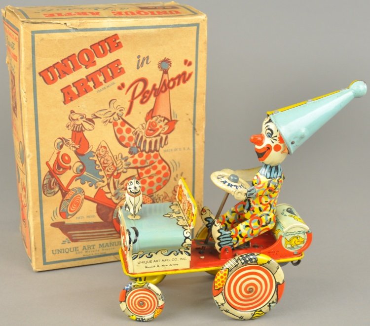 "UNIQUE ARTIE" CLOWN CAR: Boxed example, Unique Art, zany clockwork lithographed tin car carries extremely colorful clown on wacky ride when activated, JoJo the dog sits on hood. 7 1/2" l.