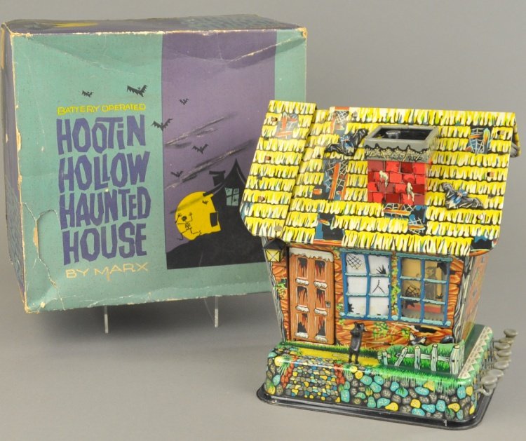 HOOTIN HOLLOW HAUNTED HOUSE: Boxed example, Marx Toys, lithographed tin, extensive graphics overall, great visual effect, levers on side control movements and actions. 10" w x 11" h.