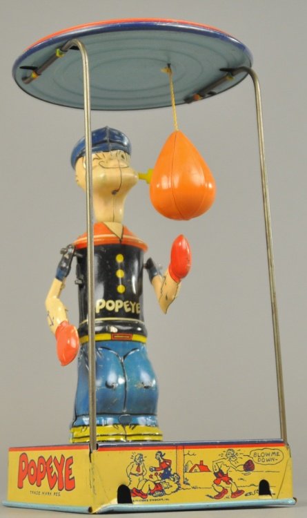 POPEYE OVERHEAD PUNCHER: Chein, c. 1930's, copr. King Features Syndicate, lithographed tin, well detailed toy depicts Popeye standing on base with celluloid punching bag suspended from canopy on wire frame. 9 1/2" h.