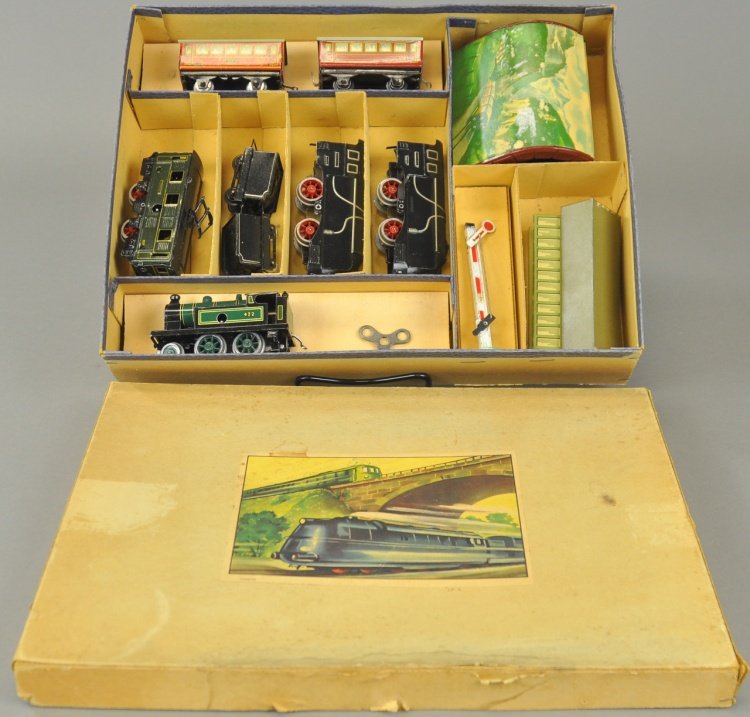 KARL BUB TRAIN SET: Boxed example, features lithographed tin, clockwork driven, locomotives and tenders together with coaches, tunnel, signal and station, nice litho to this miniature set, paper label on lid. Box 10" x 1