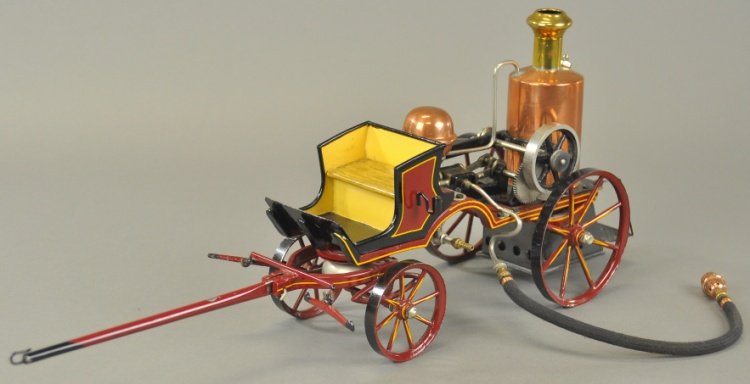 MARKLIN STEAM FIRE ENGINE: Germany, very well detailed overall, features brass boiler, fine appointments, fully hand painted in rich maroon color with yellow trim, flywheel activates pistons on sides, engine has open bench seat