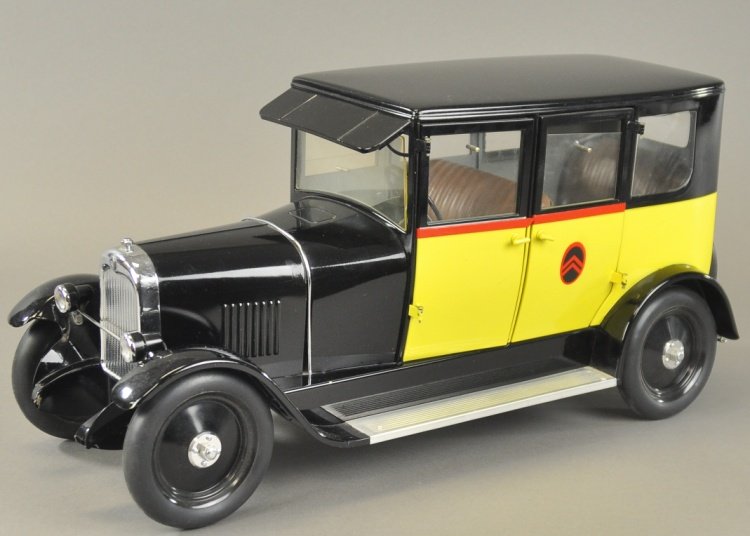 B14 TAXI: Citroen, France, reissued example, luxury model, large scale with full running boards, features celluloid windows, embossed seating, spare mounted on rear, elaborate gear system. 20 1/2" l.