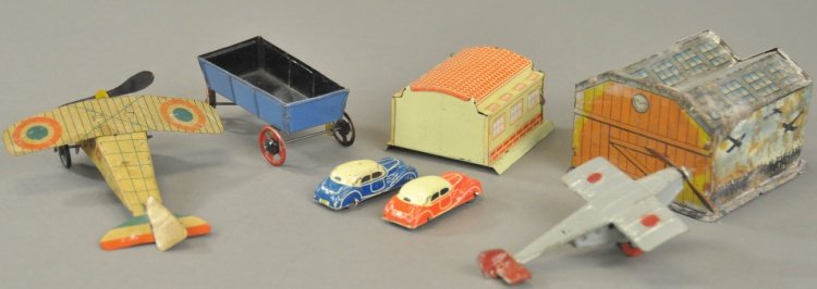 GROUPING OF PENNY TOYS: Mixed lot includes: two single prop airplanes, small wagon and two cars with garage. 2 1/2" - 5" l.