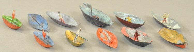 GROUPING OF OPEN HULL BOATS: Germany, hand painted tin examples, includes eleven simple fishing style boats, most with figure, varied colors. 2 1/4" - 3 1/2" l.