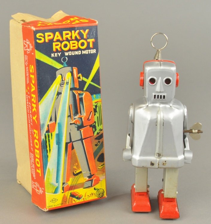 SPARKY ROBOT TOY: Japan, KO, boxed example, silver tin finished body, wind-up action, great box lid graphics. 7 1/2" h.