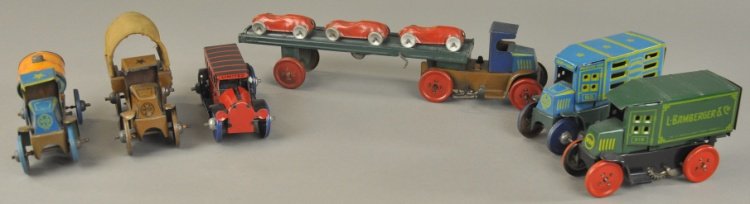 GROUPING OF SMALL MARX VEHICLES: Assorted lithographed tin examples, lot features car carrier, Army truck, oil truck, Liberty bus, Bamberger's Delivery van and American Trucking Co. van. 5" to 12" l.