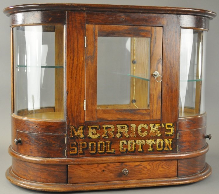 MERRICK SPOOL COTTON STORE DISPLAY: Large store display case for "Merrick Spool Cotton" threads, the case is heavy oak with curved glass ends, rear entry with interior light. 23" h.