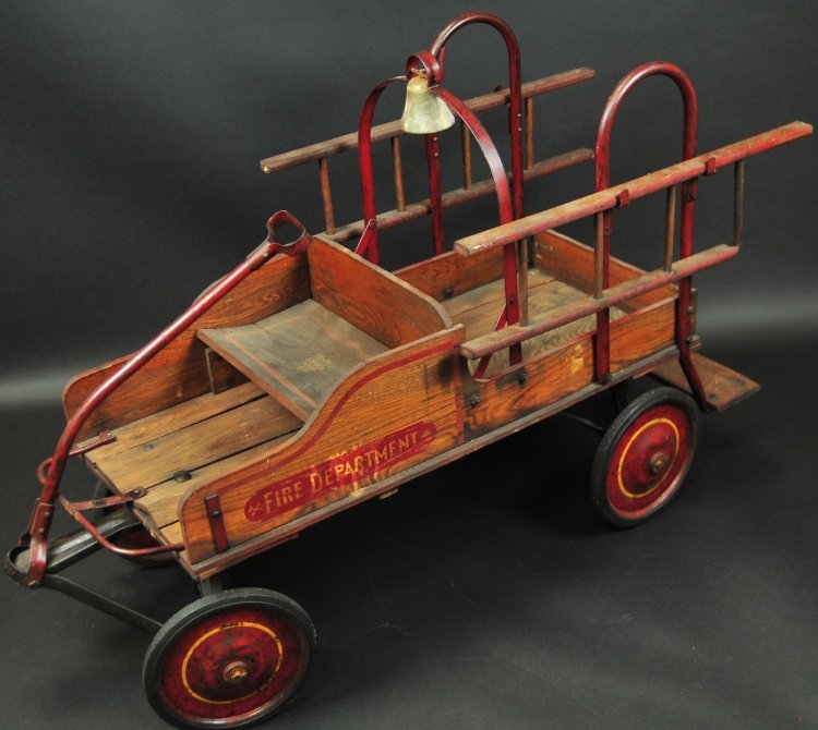 AMERICAN NATIONAL FIRE PEDAL TRUCK: circa 1920's, early wood framed body with metal hand rails and disc wheels, includes ladders fitted on side supports, maintains all wood and metal frame work and one of a kind conversion fire wagon, a