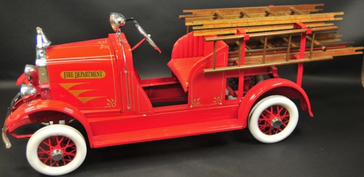 AMERICAN NATIONAL LADDER TRUCK PEDAL CAR: Impressive scale, pressed steel body, painted in classic fire engine red, fully appointed with headlights, spotlight, supports and wooden ladders, white and red metal wheels with rubber tires, full de