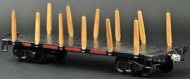 BUDDY 'L' OUTDOOR RAILROAD FLAT CAR #1006: circa 1926-1931, pressed steel, painted in black overall, decal reads "68502," stake pockets on each on each side. 20" l.
