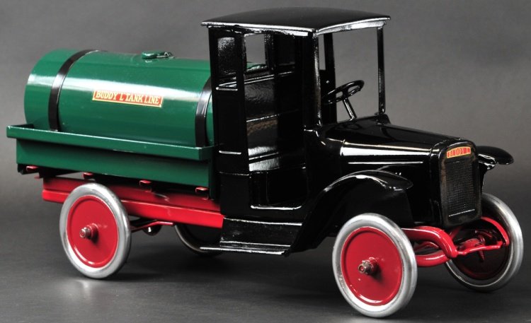 BUDDY 'L' OIL TRUCK: c. 1927, pressed steel, black cab with green tank body, red chassis, aluminum disc wheels, decals on sides, spigot on rear of tank. 25" l.