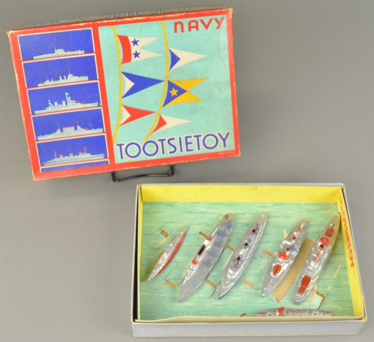 TOOTSIETOY NO. 5750 NAVY SET: Nice boxed set includes six assorted battleships and destroyers that sit on an ocean, decorated insert bottom, colorful graphics throughout. 8 1/4" x 11 1/2".