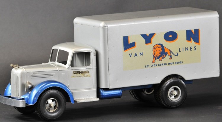 SMITH MILLER L-MACK LYON VAN LINES TRUCK: Die-cast cab done in grey with silver box van and side decals that read, "LYON Van Lines Let Lyon Guard Your Goods." 20 1/2" l.