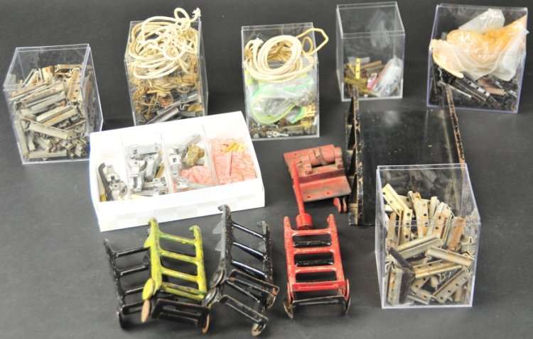 BUDDY L PARTS LOT: Grouping of varied parts include: truck couplers, nuts, bolts, hand throw switch, buddy l track connectors, new couplers, buddy l hand trucks and one trestle section.