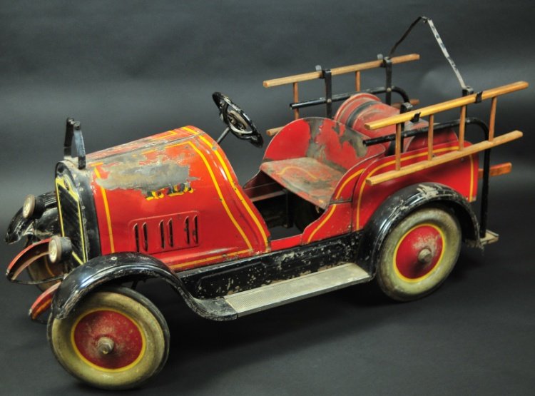 GENDRON HOSE REEL PEDAL CAR: circa 1930's, pressed steel, impressive example features side rails and wooden ladders, bell support on hood, hose reel in body, dummy lights, painted disc wheels, rubber tires, Cadillac emblem appear
