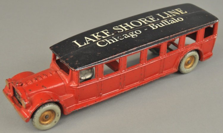 ARCADE LAKE SHORE LINES BUS: Cast iron Fageol bus, red and black overall, lettered Lake Shore Lines on the roof, this is a repainted example. 12" l.