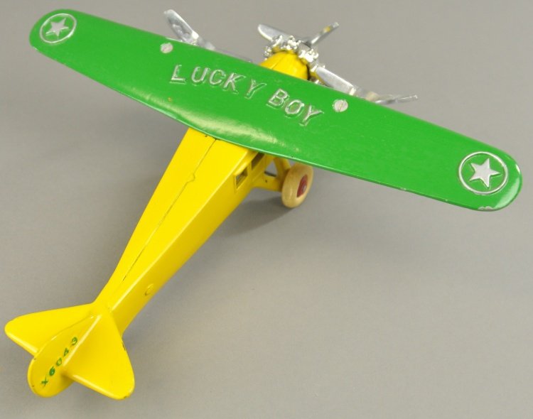DENT LUCKY BOY TRIMOTOR: Cast iron, a beautifully restored example done in yellow fuselage with green wings and features three nickel propellers and rubber tires. 12 1/2" wingspan.