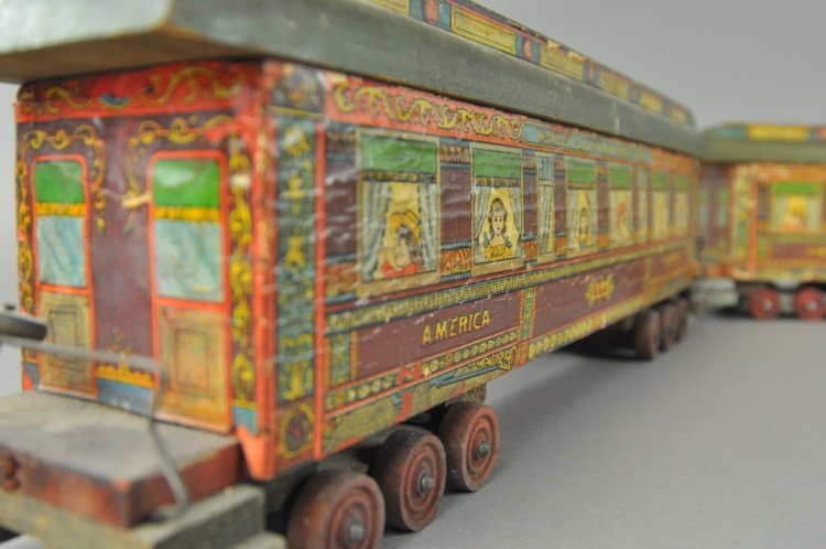 BLISS WORLD COLUMBIAN TRAIN SET: Paper litho over wood, includes a large 4-2-2 locomotive together with two well scaled passenger cars, each with removable roof and nice paper graphics to bodies. Cars 20" l.