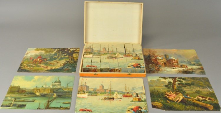 BOXED CUBE PUZZLE SET: Germany, very early paper lithographed covered cardboard cubes, includes guide sheets, box lid features five children at tennis match scene, very colorful. 9" x 12".