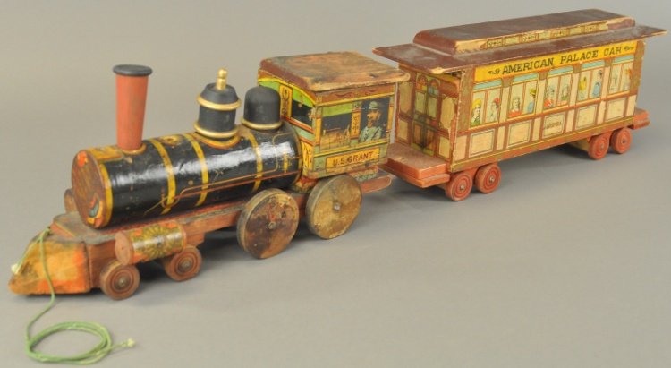 BLISS U.S. GRANT FLOOR TRAIN: Lithographed paper over wood example, features "U.S. Grant" locomotive, together with "American Palace Car - Columbia." Cars 15 1/2" l.