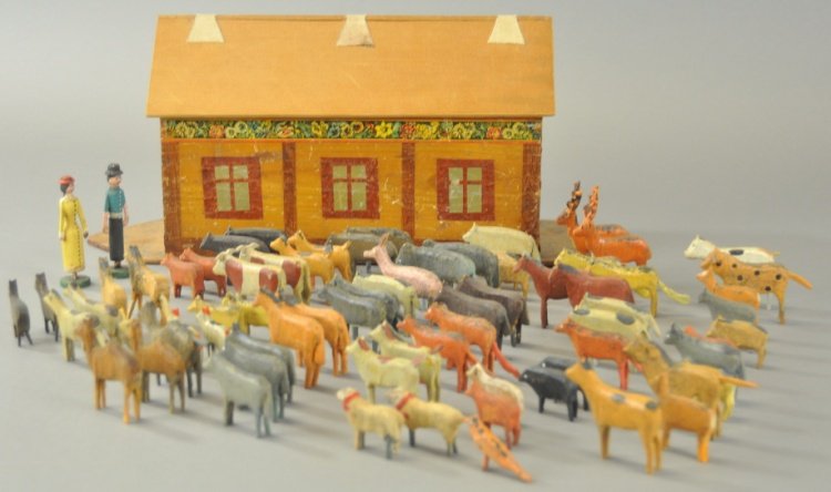 FLAT BOTTOM ARK WITH ANIMALS: Paper litho trim over wood, flat bottom example contains over fifty wood carved animals, roof lifts for storage. 16" l.