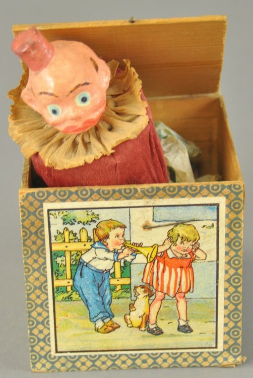 HAPPY HOOLIGAN JACK IN THE BOX: Germany, molded composition head, hand painted features, familiar character in paper lithographed wooden box. Closed 3 1/2" h.