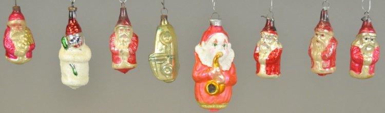 GROUPING OF EIGHT GLASS ORNAMENTS: Little boy with horn, five Santas, snowman and automobile, all from various time periods. 2" - 4" l.