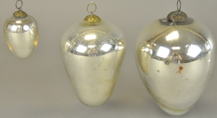 * THREE EGG SHAPED KUGELS: Three bright silver Kugels in assorted sizes and shapes, some minor areas of finish loss. 2" - 5" l.