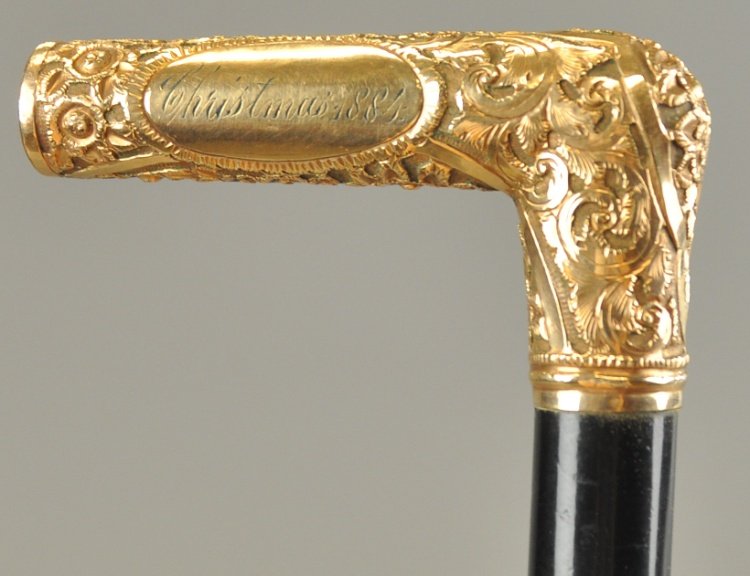 GOLD FILLED CHRISTMAS PRESENTATION CANE: This gold handle cane is marked, "W.E.F. Christmas 1884," on the handle with the manufacturer's mark, "RSF & Co.," a nice early Christmas day presentation piece. 35" l.